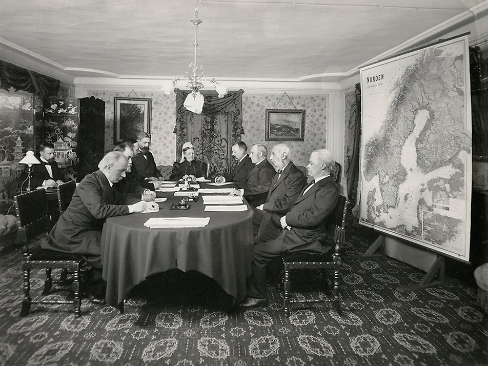 Queen Sofia as chair of the Jubilee Committee for combating tuberculosis. The committee was established on 22 October 1897 to administer the Swedish people's donation of 2.2 million kronor that had been raised to pay tribute to King Oskar and Queen Sofia in honour of King Oskar's 25th jubilee (18 September 1897). The group is sitting in a room behind the Bernadotte Apartments at the Royal Palace of Stockholm..